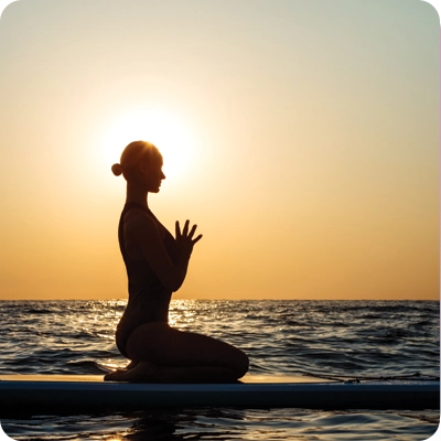 Woman sitting on a paddle board