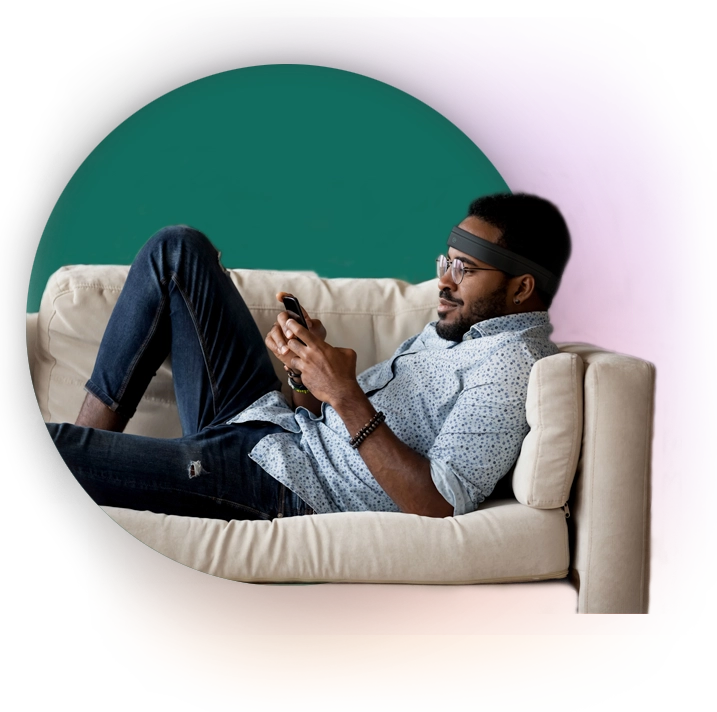Man on couch using Neurovine technology